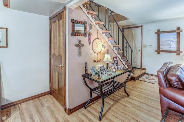 entryway with light hardwood / wood-style floors