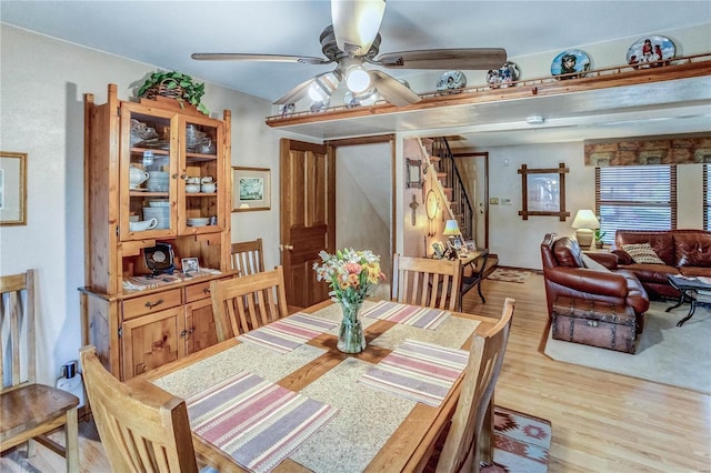 dining space featuring ceiling fan and light hardwood / wood-style floors