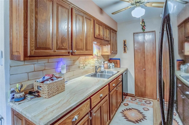 kitchen featuring backsplash, sink, and ceiling fan