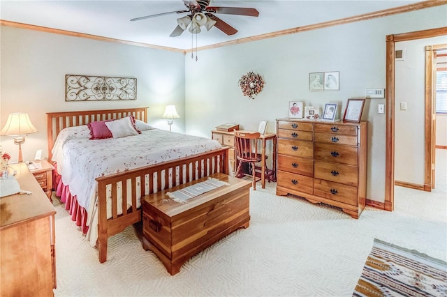 carpeted bedroom featuring crown molding and ceiling fan