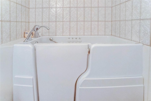 bathroom with a tub to relax in