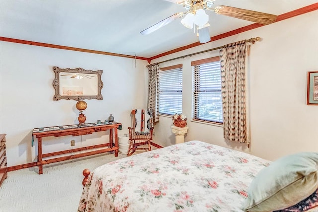 bedroom featuring ceiling fan, carpet flooring, and crown molding