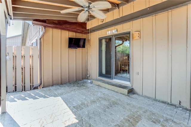 doorway to property with a patio and ceiling fan