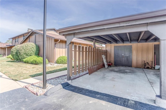 view of parking / parking lot with a carport