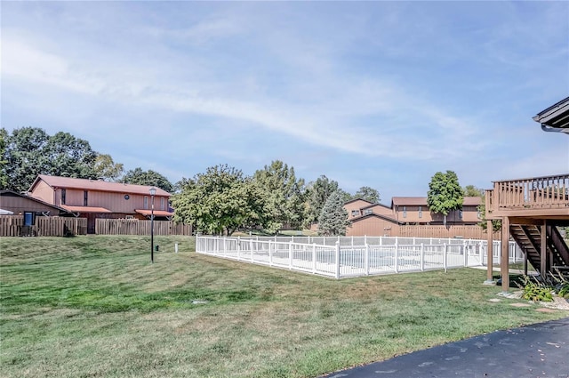 view of yard featuring a wooden deck