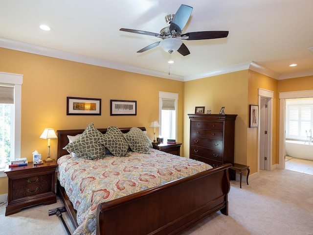 bedroom featuring ceiling fan, ornamental molding, multiple windows, and light colored carpet