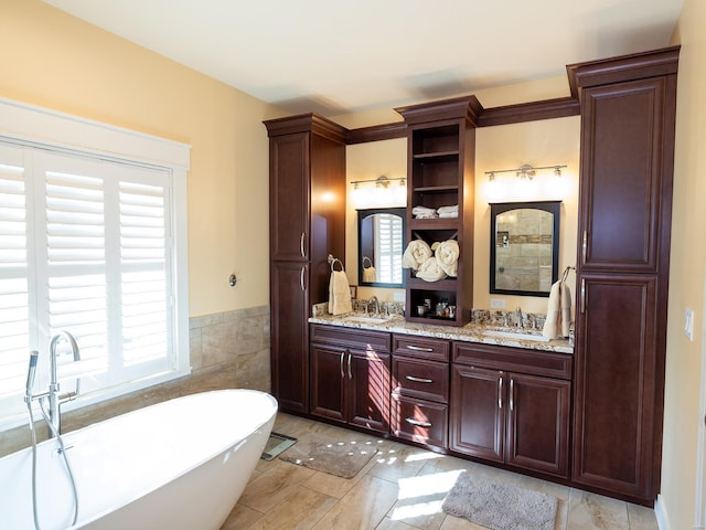 bathroom with vanity and a bathing tub