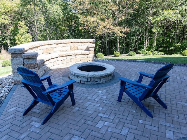 view of patio with a fire pit