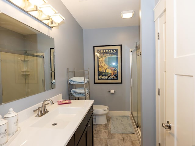 bathroom featuring vanity, walk in shower, toilet, and tile patterned floors