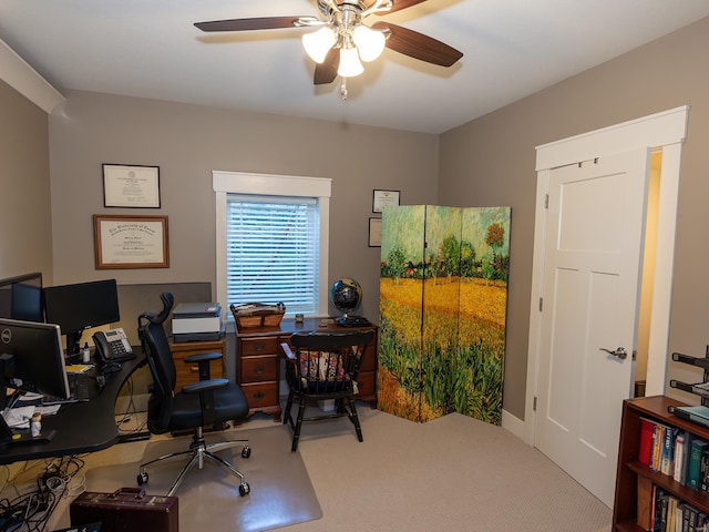 carpeted home office with ceiling fan