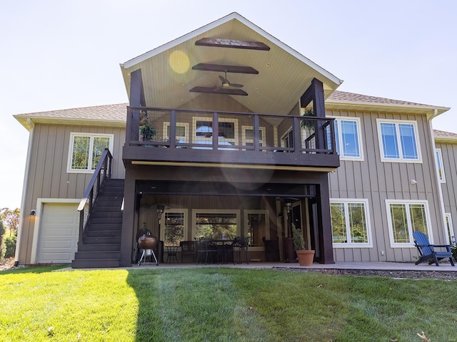 back of house with a patio area, a lawn, and ceiling fan