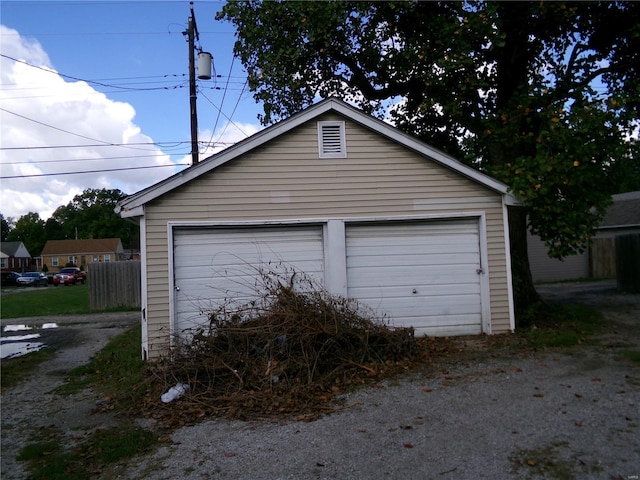 detached garage with fence