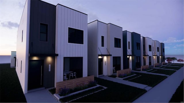 view of outdoor building at dusk