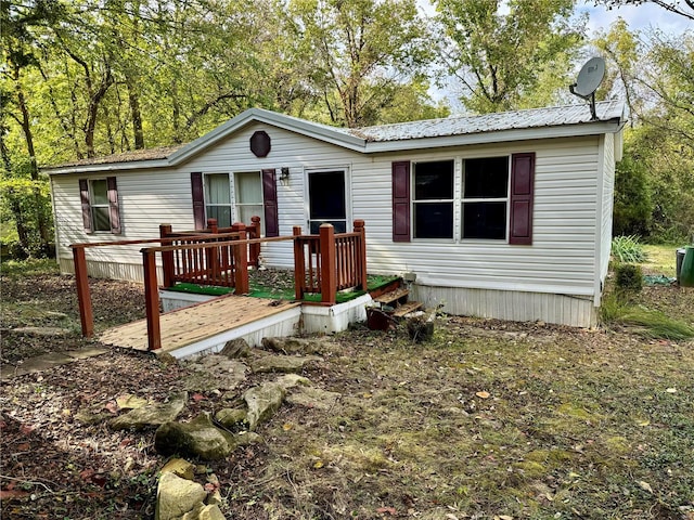 manufactured / mobile home with a wooden deck