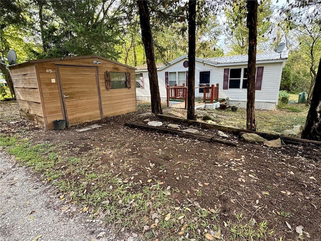 exterior space with a storage shed