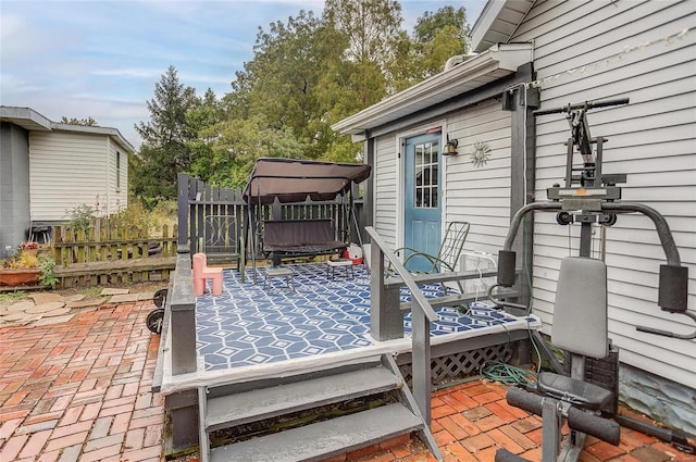 wooden terrace with a patio area and a gazebo