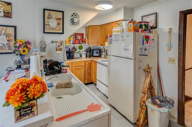 kitchen with white appliances and sink