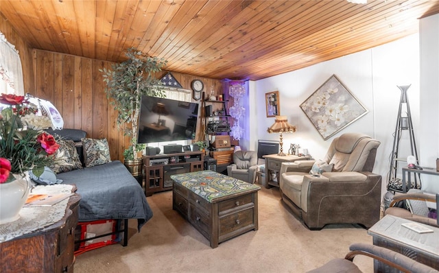 carpeted living room with wood ceiling and wood walls