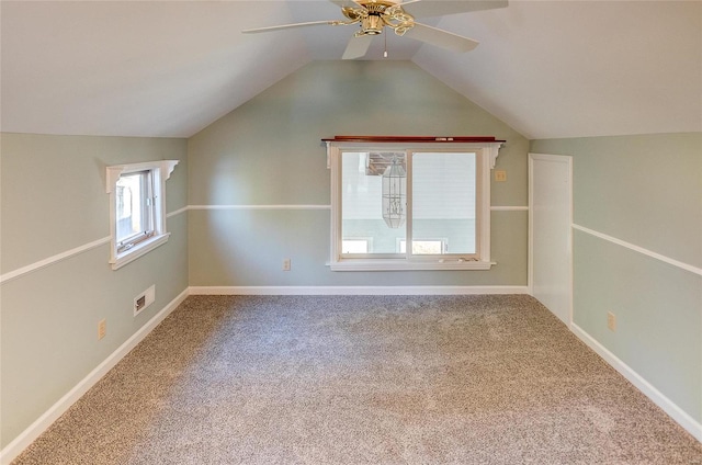 additional living space with vaulted ceiling, ceiling fan, and carpet floors