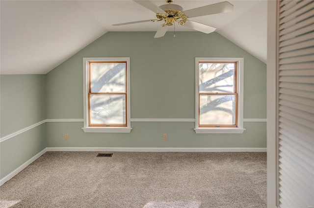 bonus room featuring carpet flooring, lofted ceiling, and ceiling fan