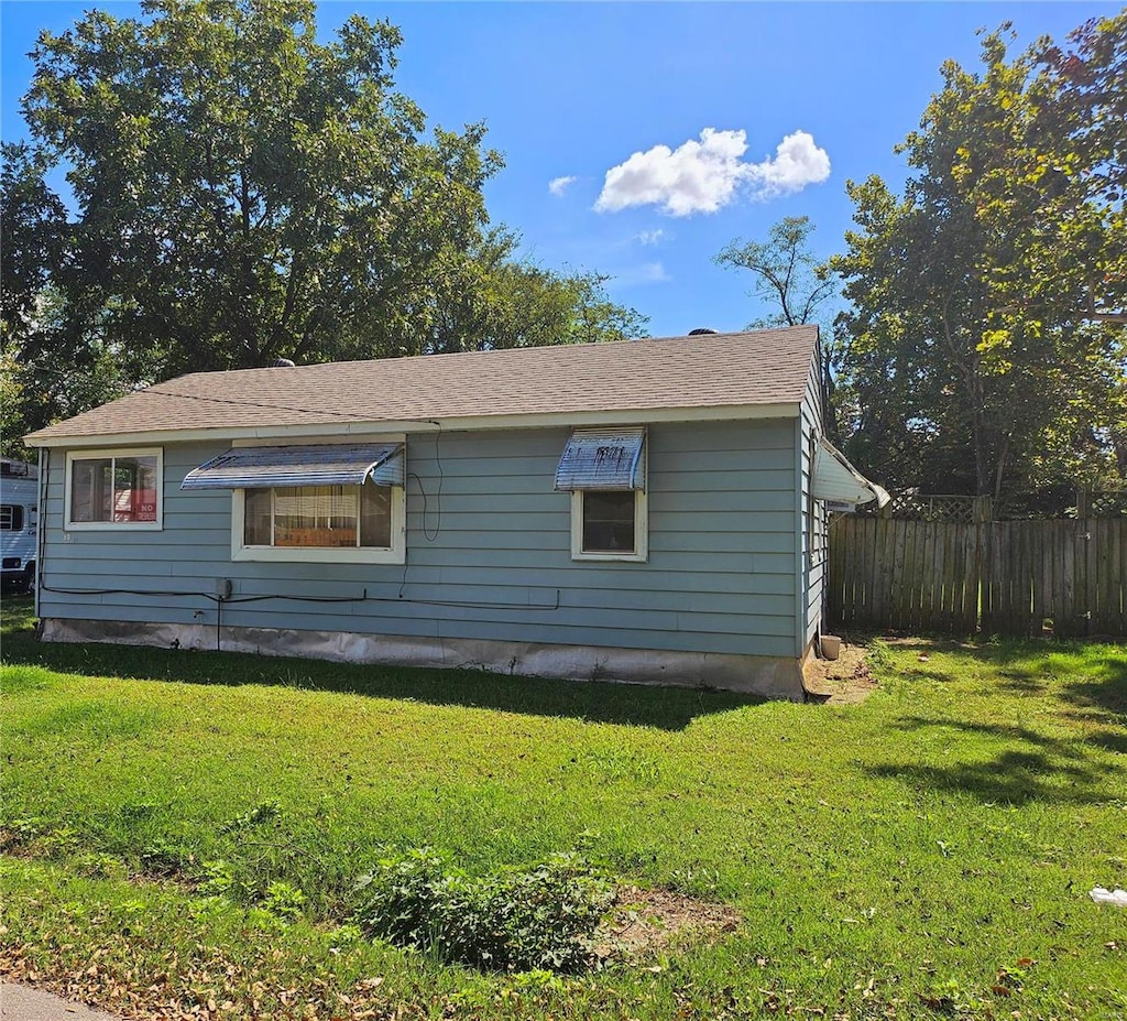 view of home's exterior featuring a lawn