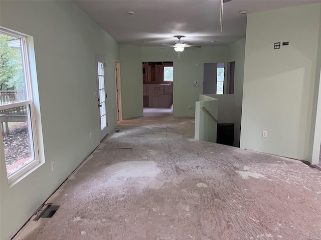 unfurnished room with ceiling fan