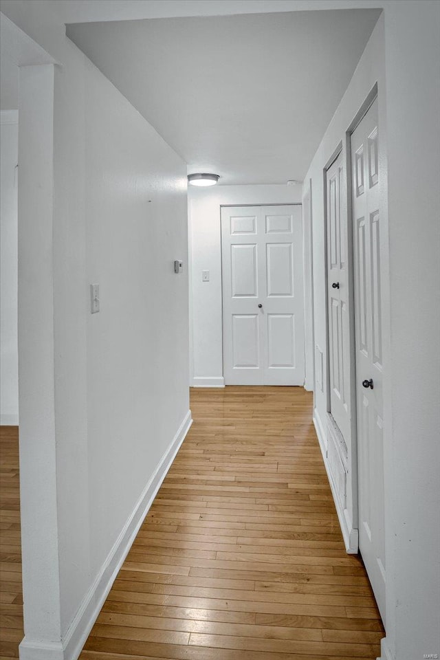 hallway featuring light wood-type flooring