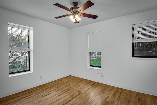 unfurnished room with ceiling fan and light hardwood / wood-style flooring