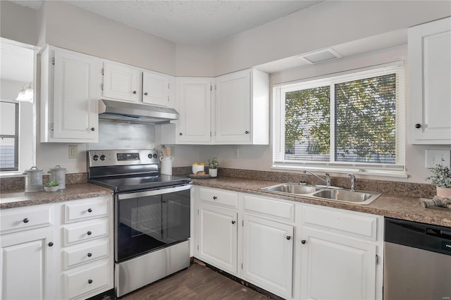 kitchen featuring white cabinetry, stainless steel appliances, and sink