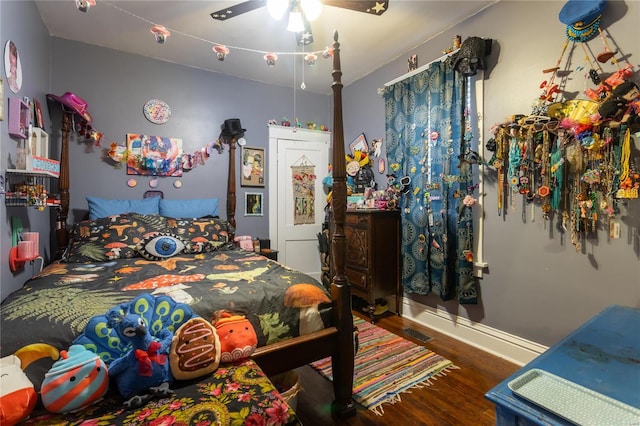 bedroom featuring dark hardwood / wood-style floors and ceiling fan