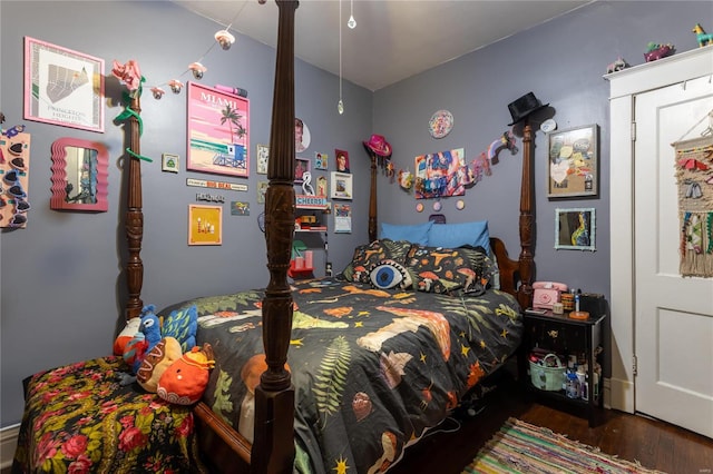 bedroom featuring dark wood-type flooring