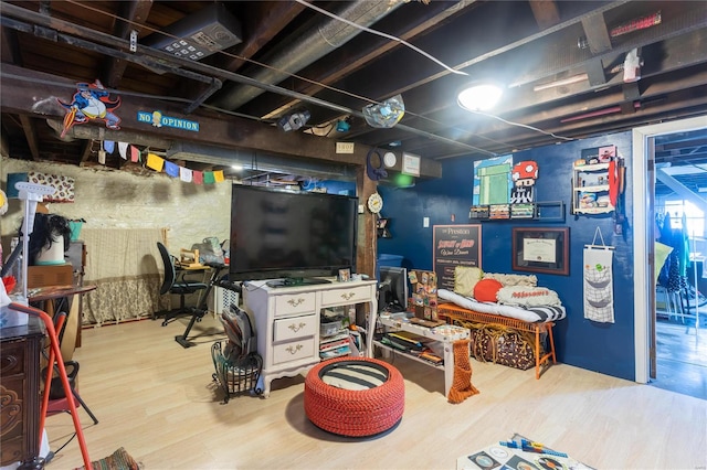 basement featuring light hardwood / wood-style flooring