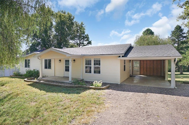 single story home with a front lawn and a carport