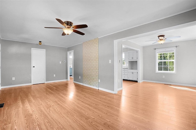 unfurnished living room featuring crown molding, ceiling fan, and light hardwood / wood-style flooring