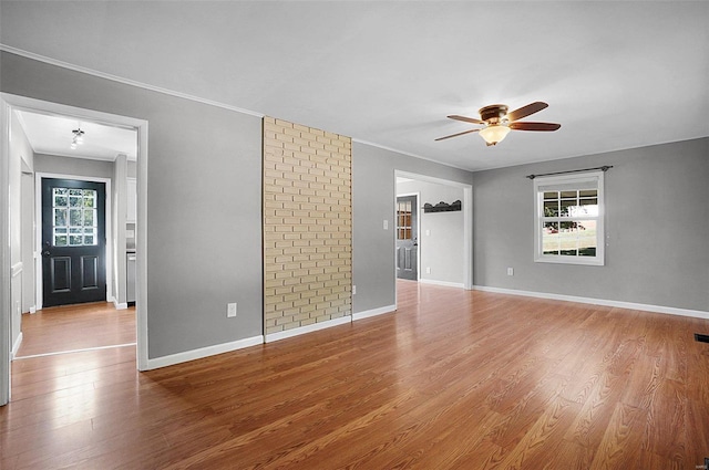 empty room featuring ceiling fan and hardwood / wood-style floors