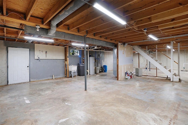 basement with water heater and sink