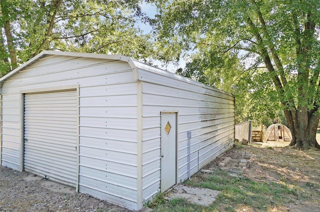 view of outbuilding featuring a garage