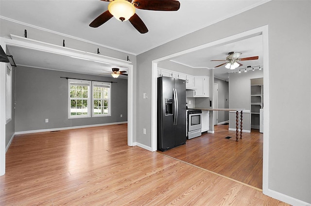 kitchen featuring light wood-type flooring, stainless steel refrigerator with ice dispenser, white cabinetry, electric stove, and ceiling fan