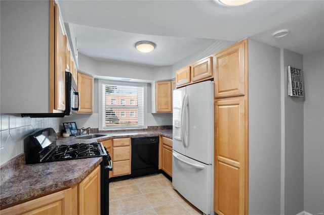 kitchen featuring black appliances, light brown cabinets, sink, and backsplash