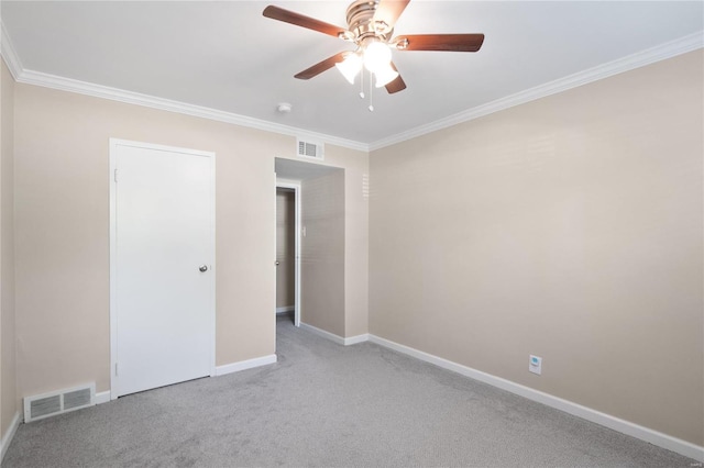 unfurnished bedroom featuring crown molding, light carpet, and ceiling fan