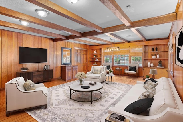 living room featuring wood walls, light hardwood / wood-style floors, and beam ceiling