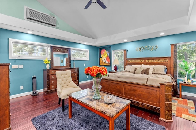 bedroom featuring vaulted ceiling, dark wood-type flooring, ceiling fan, and a wall unit AC