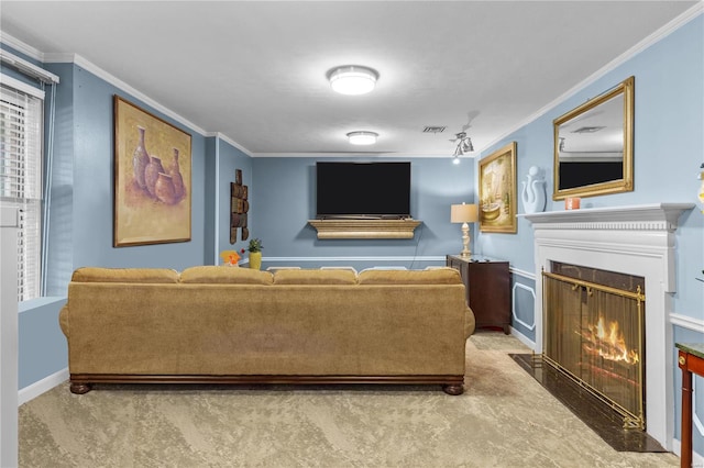 living room featuring ornamental molding and carpet flooring