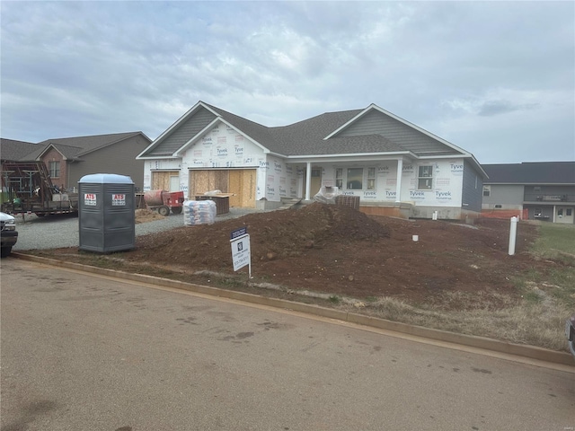 view of front facade featuring a garage and covered porch