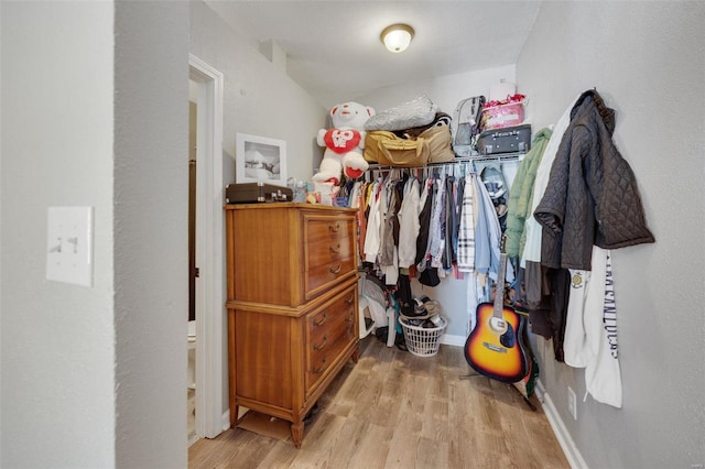 spacious closet with light wood finished floors