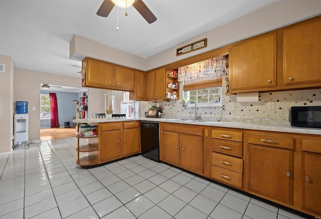 kitchen with ceiling fan, light tile patterned flooring, plenty of natural light, and black appliances