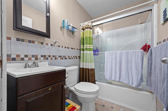 full bathroom featuring tile walls, vanity, toilet, and shower / bath combo with shower curtain