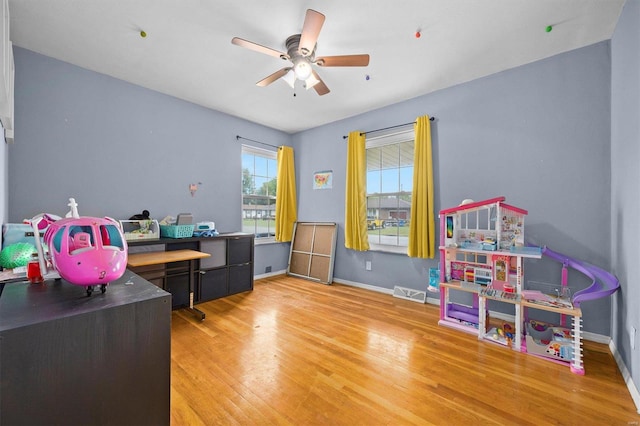 interior space with ceiling fan and light wood-type flooring