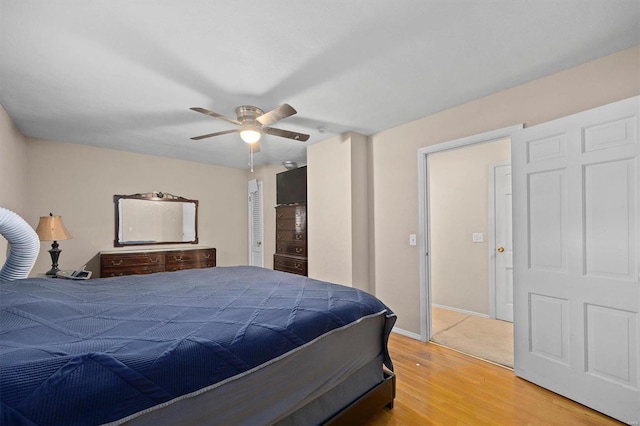 bedroom featuring wood-type flooring and ceiling fan