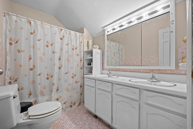 bathroom with lofted ceiling, walk in shower, tile patterned floors, vanity, and toilet